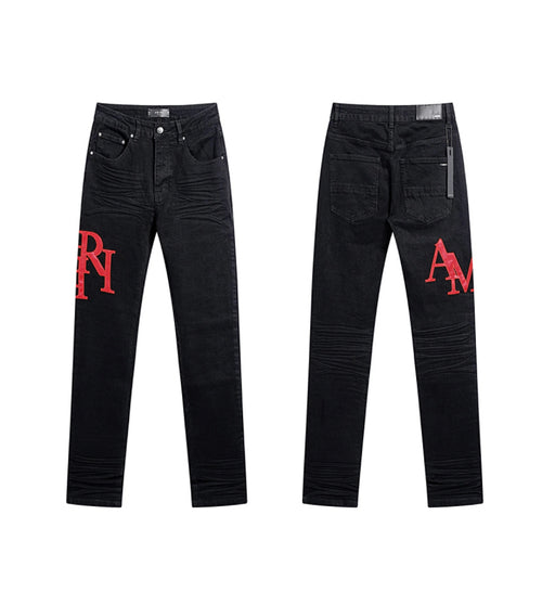 AMIRI STAGGERED LOGO SKINNY JEAN - Black Red
